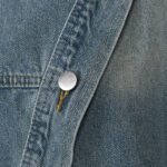 Notched Lapel With A Stylish Single-breasted Slant Button Closure - Image 2